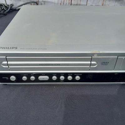 Philips DVD /VHS player with an assortment of DVDS