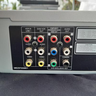 Philips DVD /VHS player with an assortment of DVDS