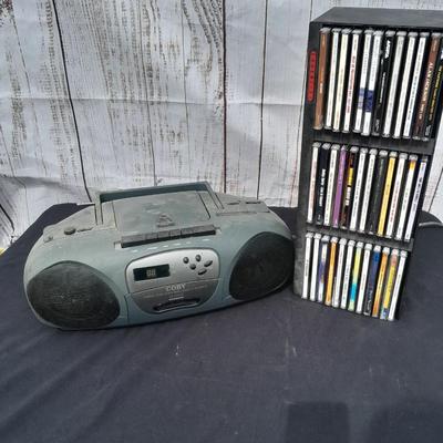 Colby boombox stereo with an assortment of music on cd's