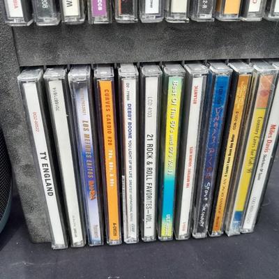 Colby boombox stereo with an assortment of music on cd's