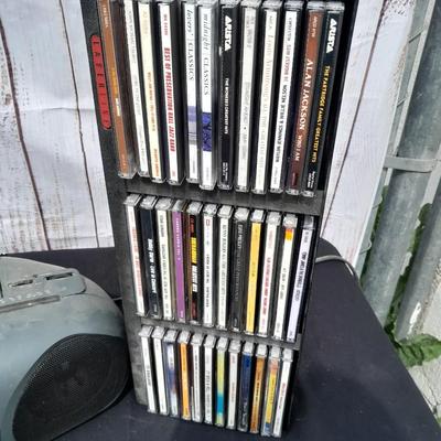 Colby boombox stereo with an assortment of music on cd's
