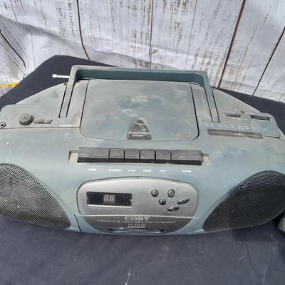 Colby boombox stereo with an assortment of music on cd's
