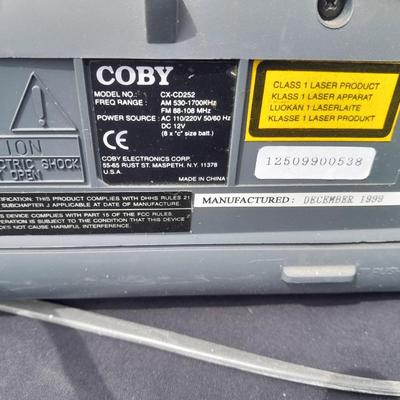 Colby boombox stereo with an assortment of music on cd's