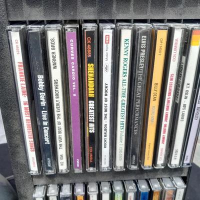 Colby boombox stereo with an assortment of music on cd's