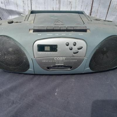 Colby boombox stereo with an assortment of music on cd's