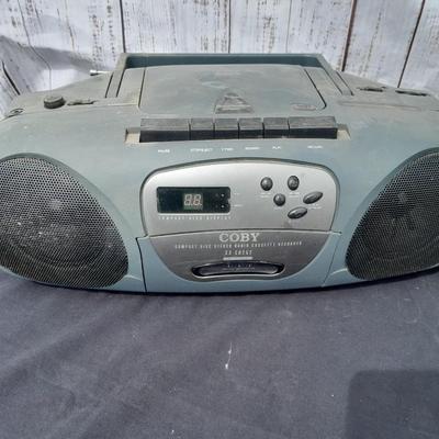 Colby boombox stereo with an assortment of music on cd's