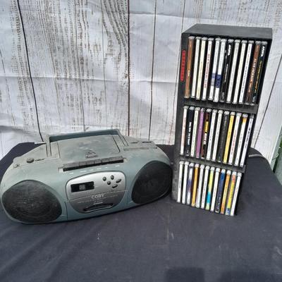 Colby boombox stereo with an assortment of music on cd's