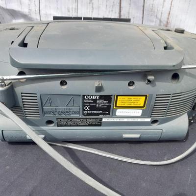 Colby boombox stereo with an assortment of music on cd's