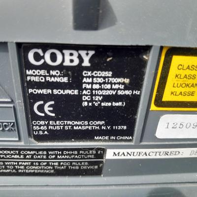 Colby boombox stereo with an assortment of music on cd's