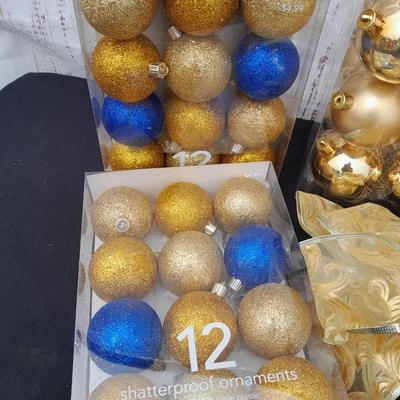 Gold glass Christmas ornaments with blue & gold glitter ornaments and a nice big bow