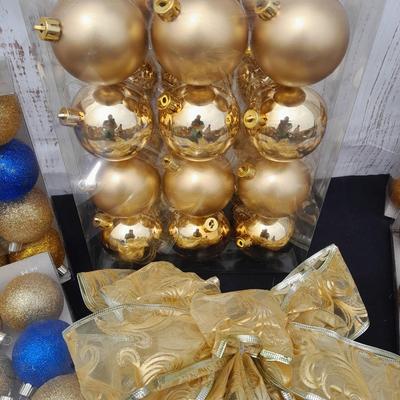 Gold glass Christmas ornaments with blue & gold glitter ornaments and a nice big bow