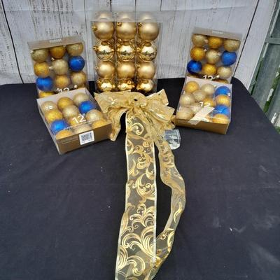 Gold glass Christmas ornaments with blue & gold glitter ornaments and a nice big bow