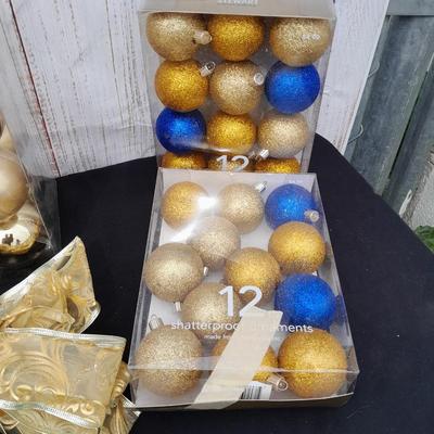 Gold glass Christmas ornaments with blue & gold glitter ornaments and a nice big bow