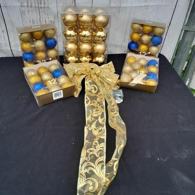 Gold glass Christmas ornaments with blue & gold glitter ornaments and a nice big bow
