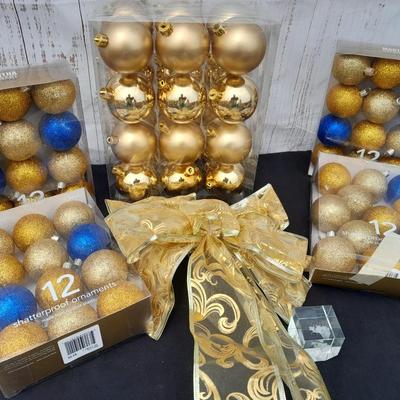 Gold glass Christmas ornaments with blue & gold glitter ornaments and a nice big bow