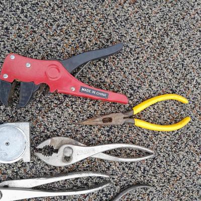 Assortment of pliers and crescent wrench