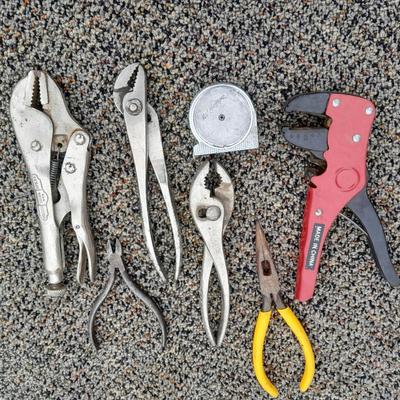 Assortment of pliers and crescent wrench