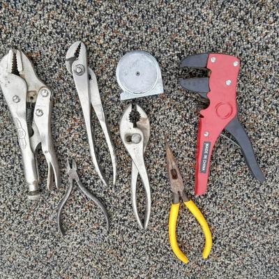 Assortment of pliers and crescent wrench
