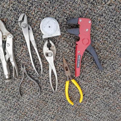 Assortment of pliers and crescent wrench