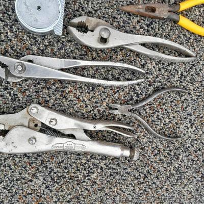 Assortment of pliers and crescent wrench