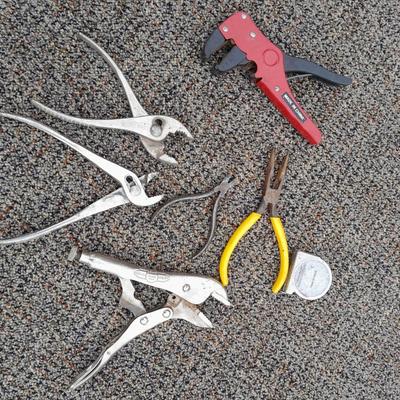 Assortment of pliers and crescent wrench