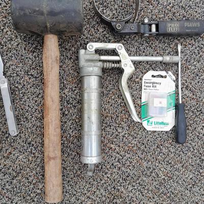 Assortment of hand tools - rubber mallet - grease gun - oil filter wrench and more