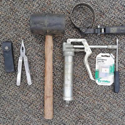 Assortment of hand tools - rubber mallet - grease gun - oil filter wrench and more