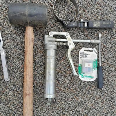 Assortment of hand tools - rubber mallet - grease gun - oil filter wrench and more