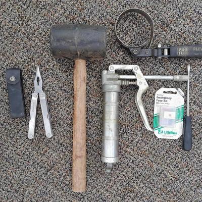 Assortment of hand tools - rubber mallet - grease gun - oil filter wrench and more