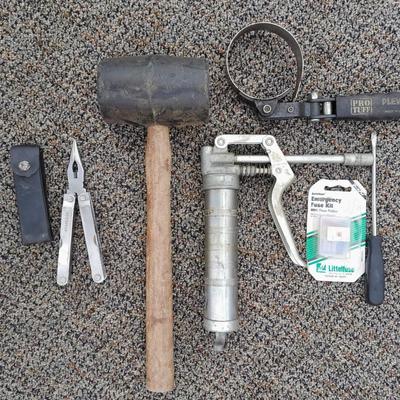 Assortment of hand tools - rubber mallet - grease gun - oil filter wrench and more