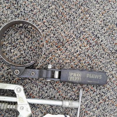 Assortment of hand tools - rubber mallet - grease gun - oil filter wrench and more