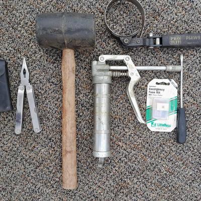 Assortment of hand tools - rubber mallet - grease gun - oil filter wrench and more
