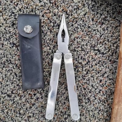 Assortment of hand tools - rubber mallet - grease gun - oil filter wrench and more
