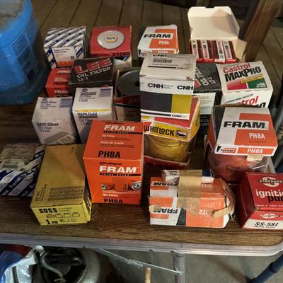 Oil filters, kerosene can, and gas cans