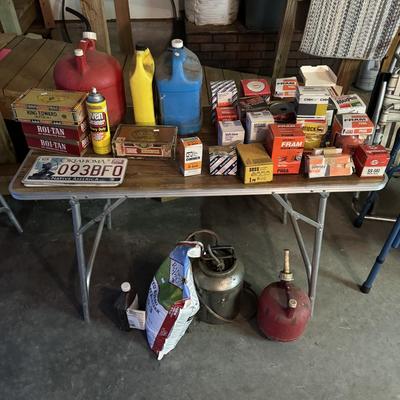 Oil filters, kerosene can, and gas cans