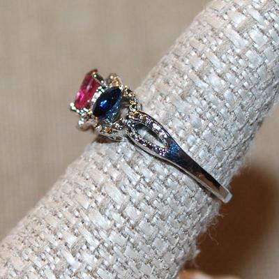 Size 8 Red, Green & Blue Main Triple Stones Ring with Surrounds on a Silver Tone Band (3.2g)