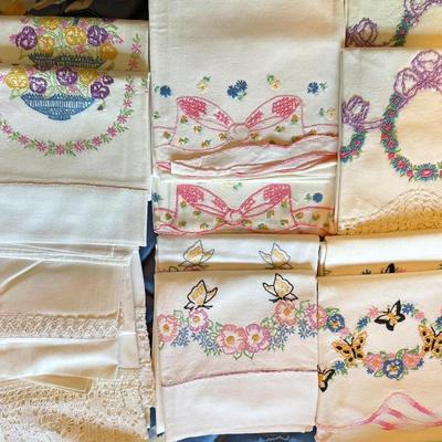 Seven pairs embroidered and lace pillowcases