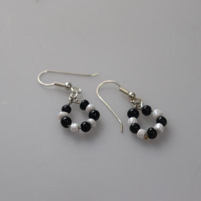 Black and white circle dangling earrings