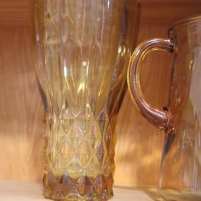 Amber colored water pitcher and vase
