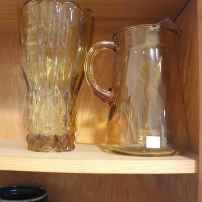 Amber colored water pitcher and vase