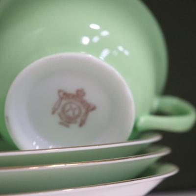 A set of Vintage Japanese hand-painted Noritake porcelain green teacup/coffee cup and saucer