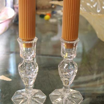 Crystal candle stick holders with two organge candles