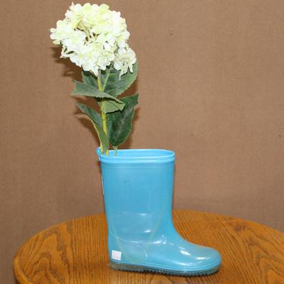 Pair of blue rubber rain boots vase