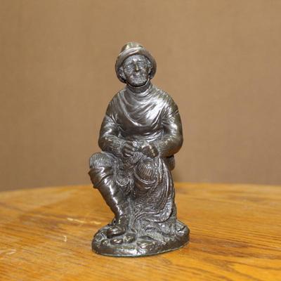 Traditional fisherman figureine
