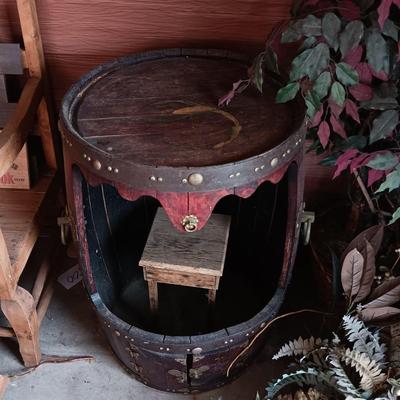 LARGE WHISKEY BARREL THAT HAS BEEN MODIFIED