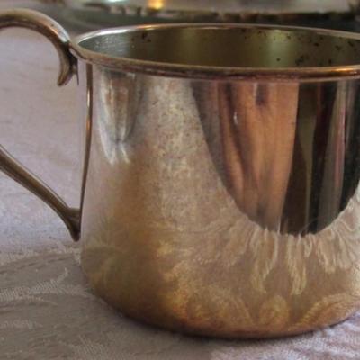 Silver-plated bell, cup, and vintage candle holder