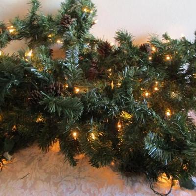 Lighted pine garland with pinecones