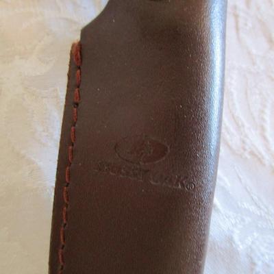 Mossy Oak fixed-blade knife with glass breaker on handle, with leather sheath