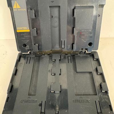 Lot 10. Canon Battery Coupler
