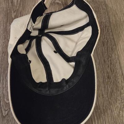 (2) Hats - One Light Tan Cotton Hat and One Orange Marmot Nylon Hat